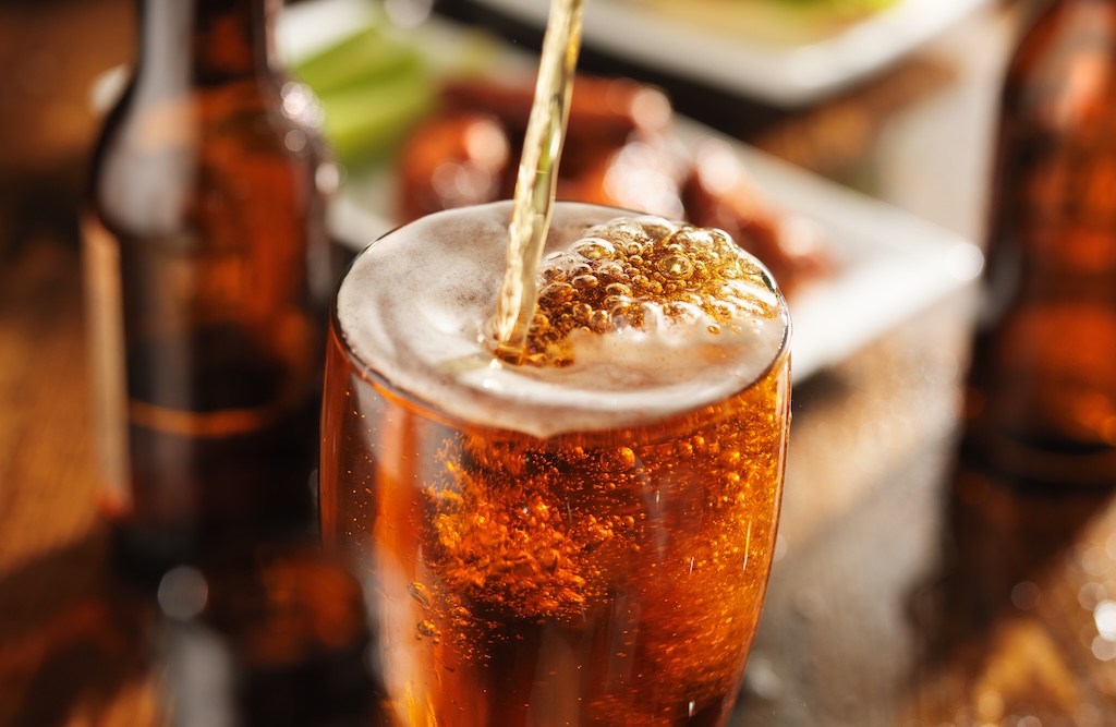 pouring beer into glass