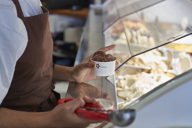man scooping ice cream