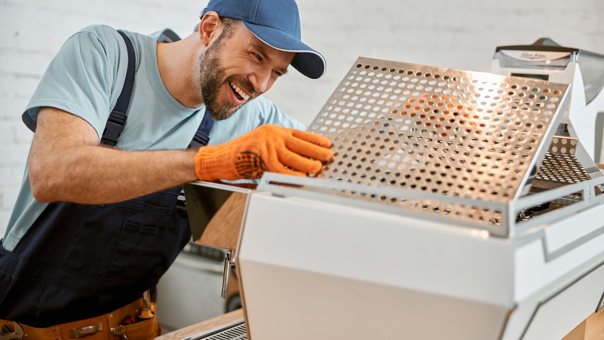 man fixing coffee machine