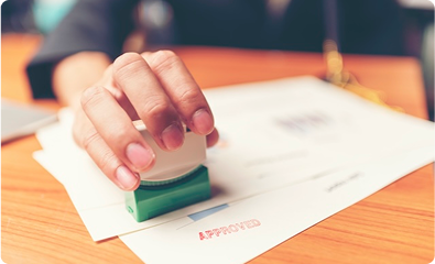 businessman stamping document approved